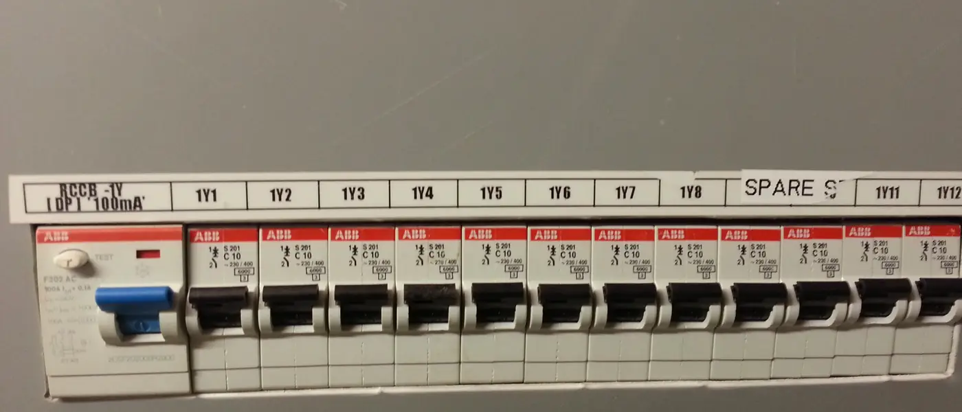 A distribution board with an RCCB on the left and a row of labelled MCBs